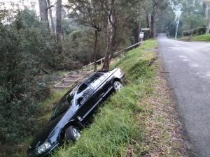 Car abandoned down embankment in Millgrove