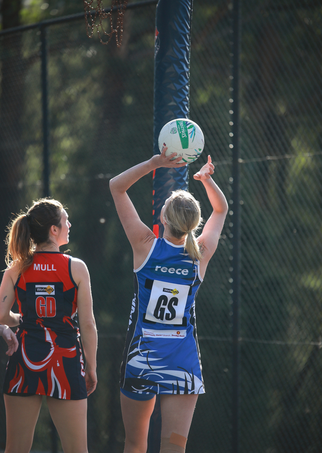 Burras battle through windy conditions to claim victory